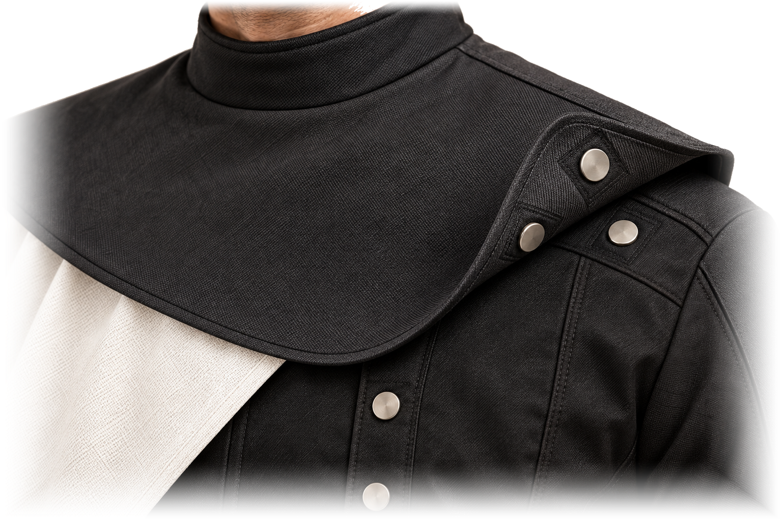 Close-up of the wrap's shoulder edge folded back to show the proposed magnetic connection points meeting matching points on the suit's shoulder.